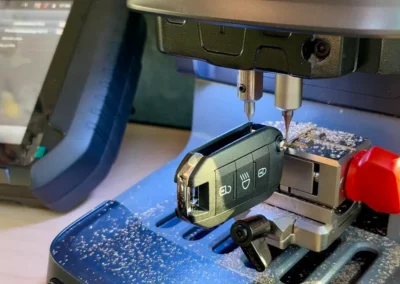Precision vehicle key cutting machine in mobile auto locksmith van